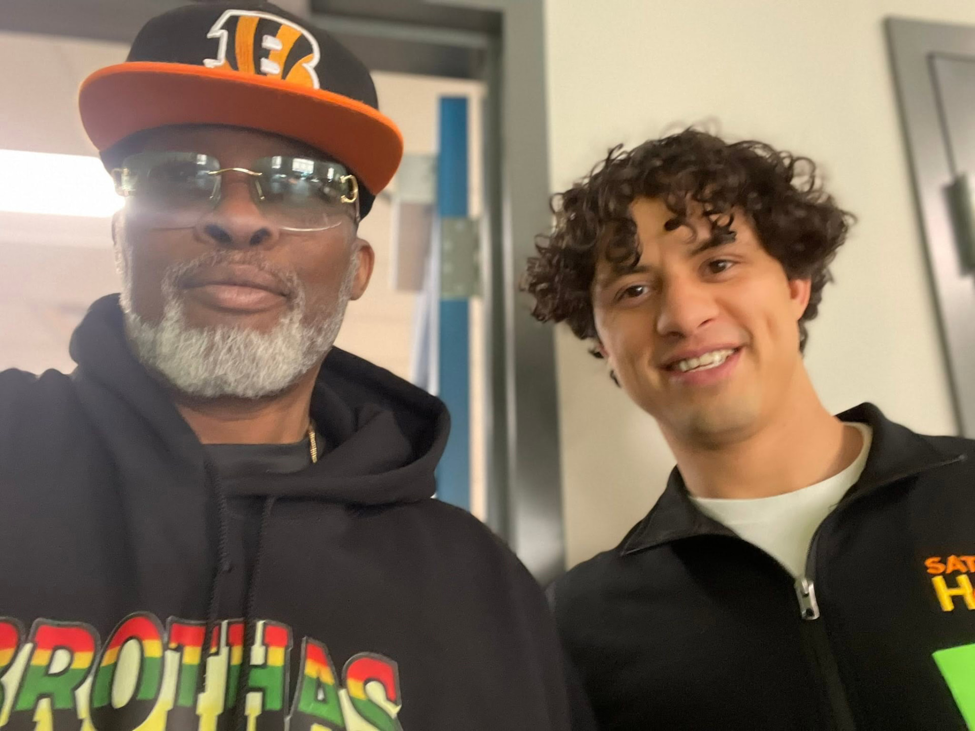 A Brothas Inc. elder and a young mentor smiling together at Saturday Hoops