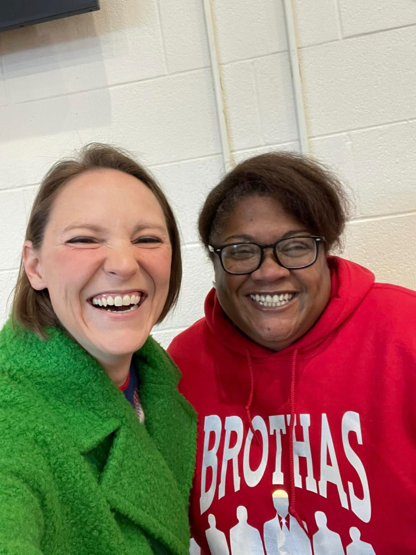 Two Brothas Inc. supporters laughing together in a candid selfie at Jingle Jam 2024