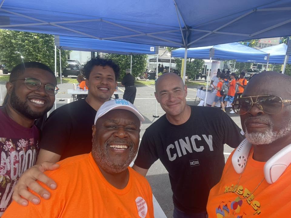 Group selfie of Brothas Inc. mentors and community partners at 3rd KidsFest