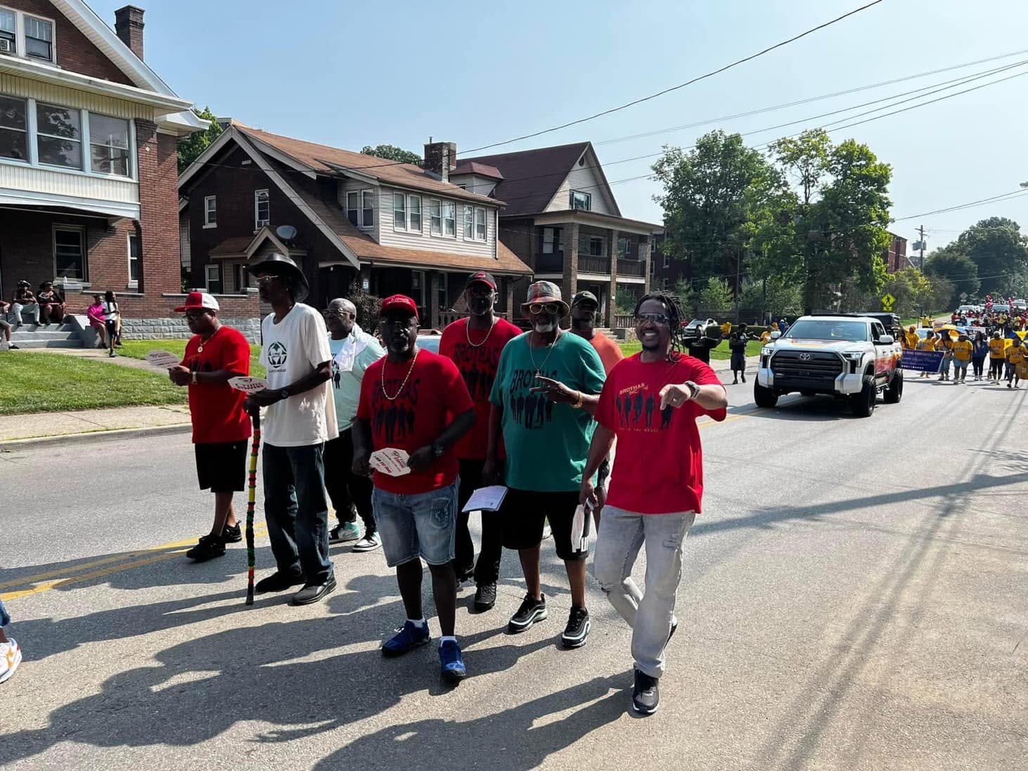 Brothas Inc. mentors marching down the street at the Black Family Reunion Parade