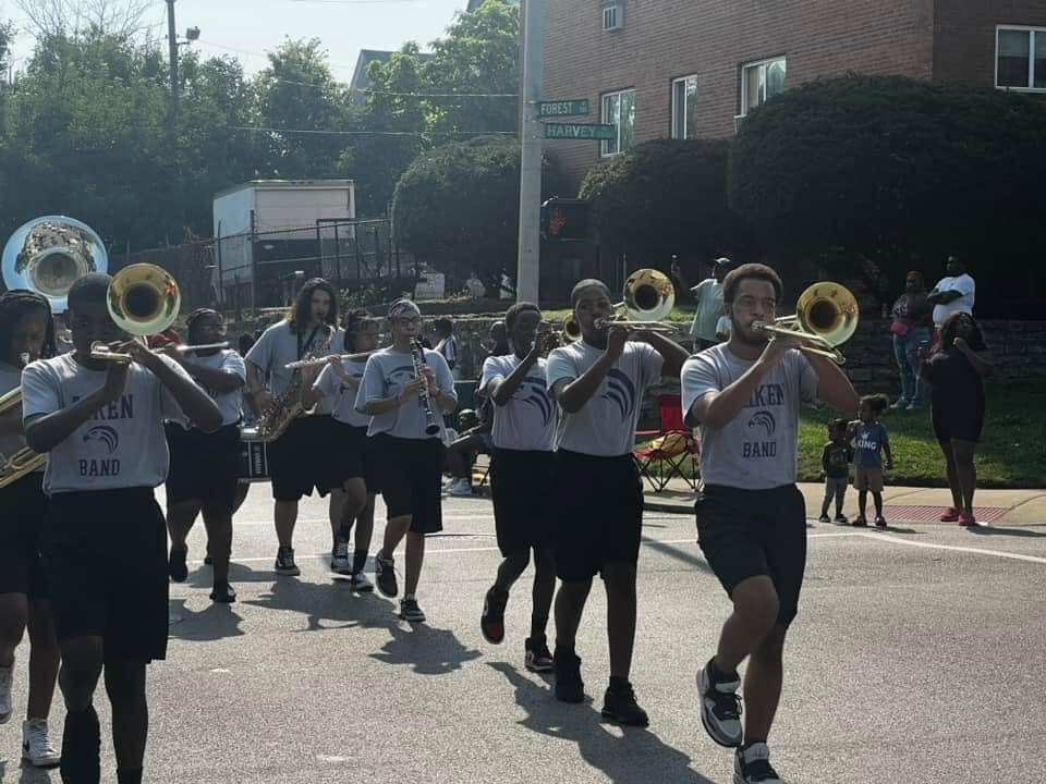 Aiken High School Falcon Marching Band brass section performing in the Black Family Reunion Parade