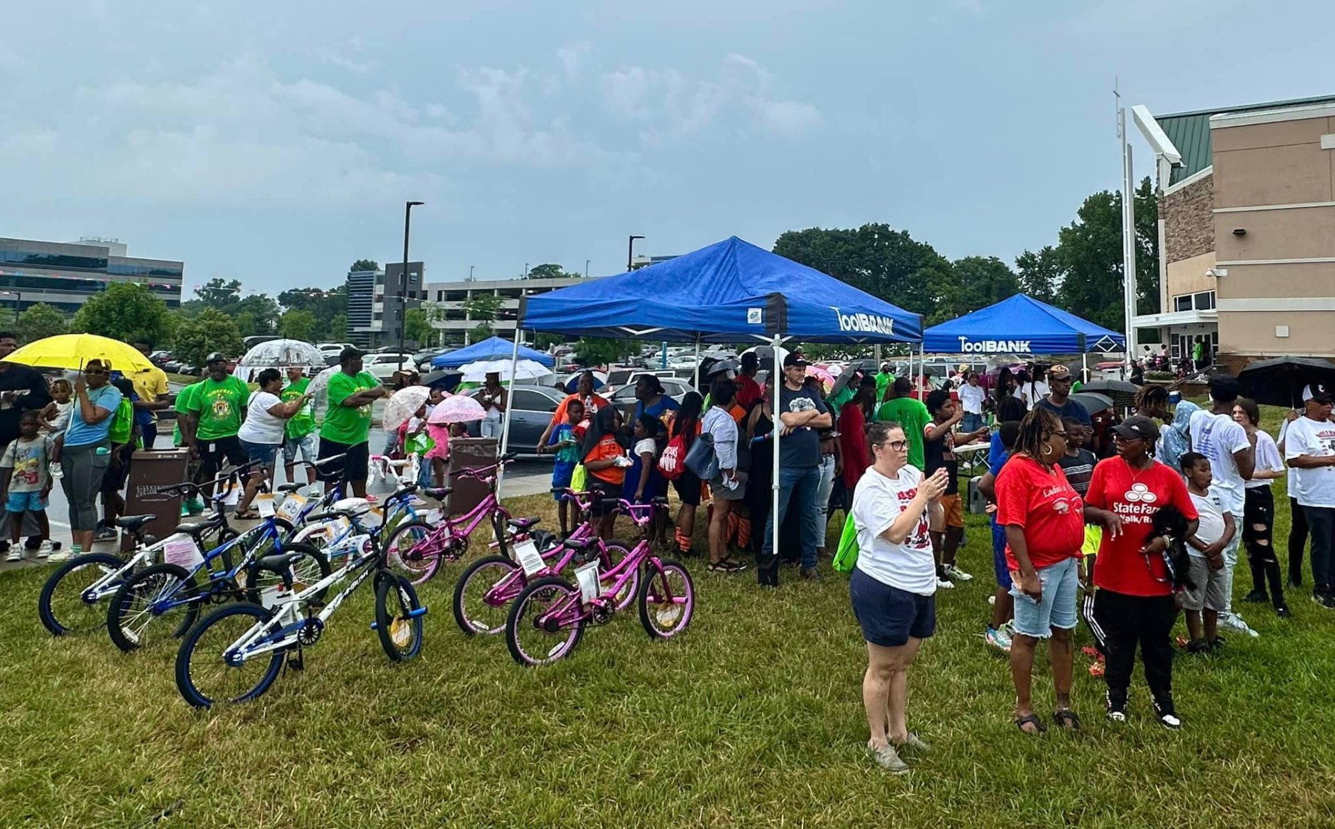 Families gathered around bikes and ToolBank tents at 2nd KidsFest