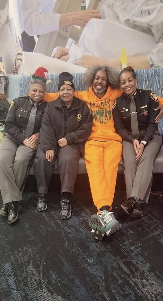 Hamilton County Sheriff deputies seated with Brothas Inc. supporters at Jingle Jam 2024