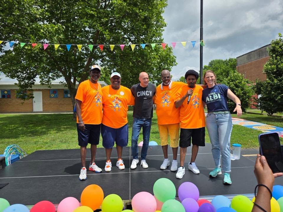 Brothas Inc. leadership and community partners lined up on the KidsFest main stage