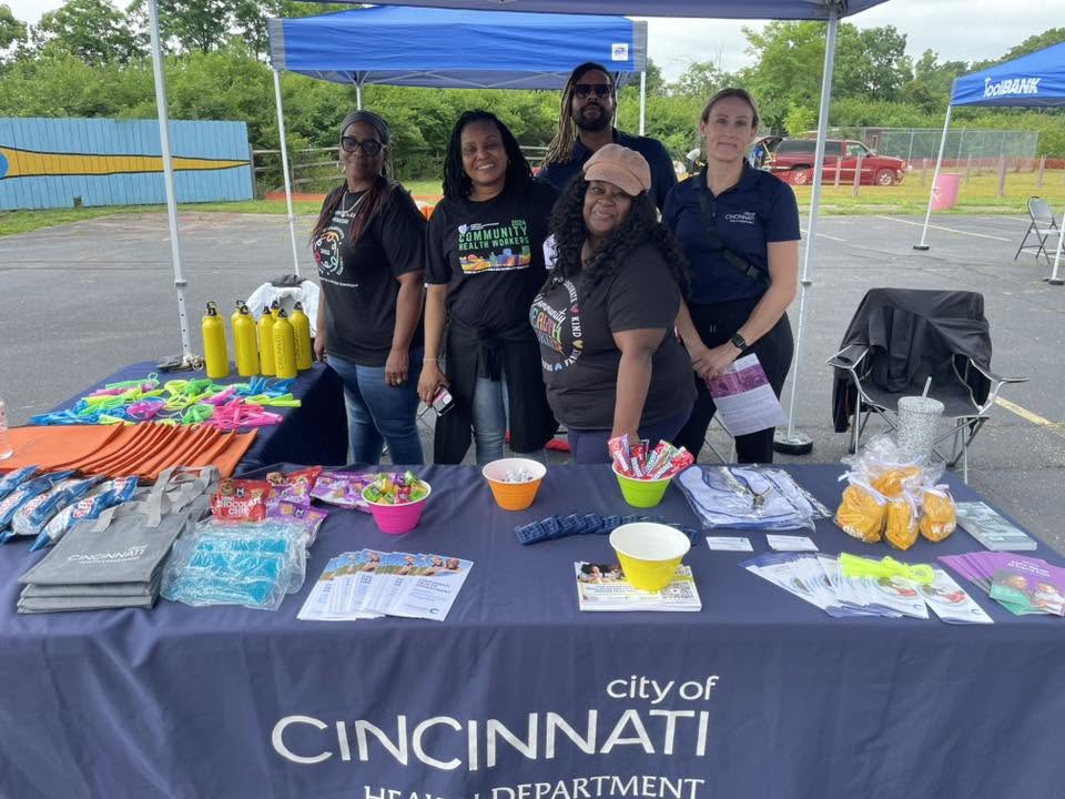 City of Cincinnati Health Department team behind resource table at 3rd KidsFest