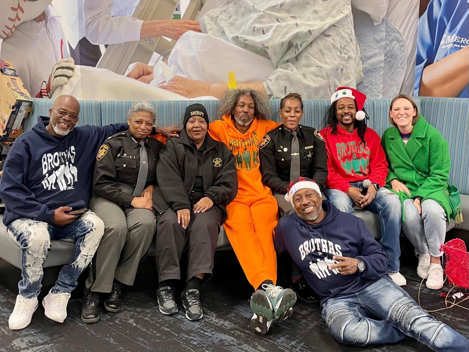 Brothas Inc. leaders posing with Hamilton County Sheriff deputies at Jingle Jam 2024