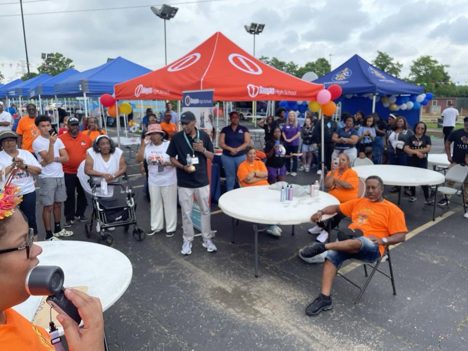 Crowd gathered under the Taft High School tent for announcements at 3rd KidsFest