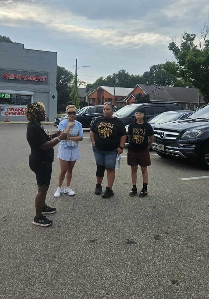 Brothas Inc. mentors engaging with community members outside a Cincinnati mini mart during Black Family Reunion 2024 weekend