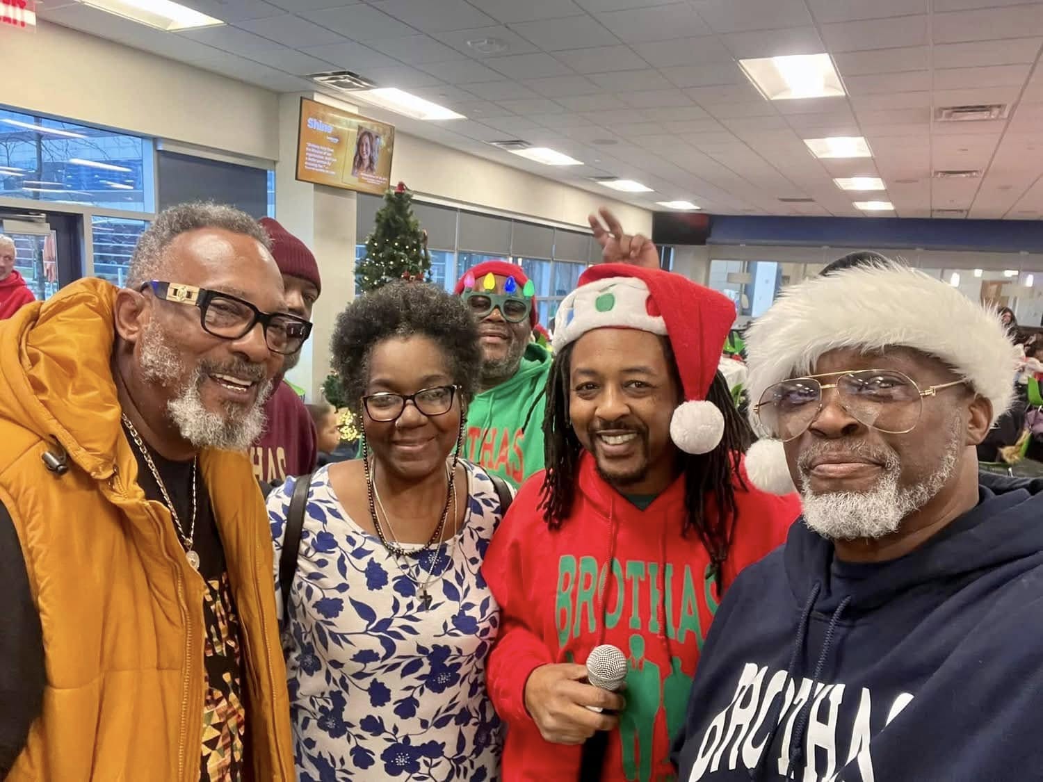 Brothas Inc. mentors and supporters gathered for a group selfie at Jingle Jam 2024